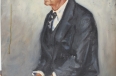 [Seated elderly man in grey suit]